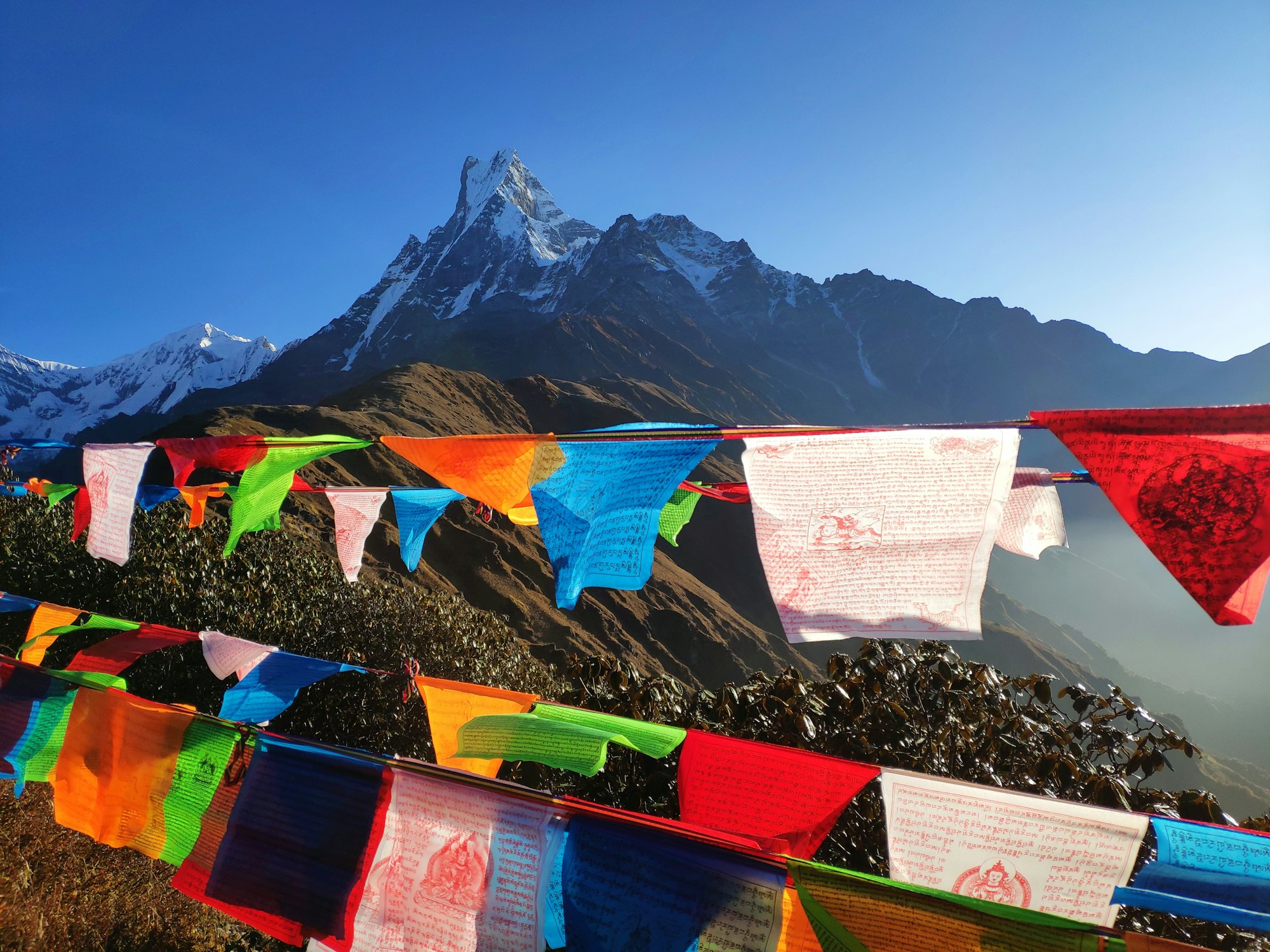 Colourful prayer flags across the mountains